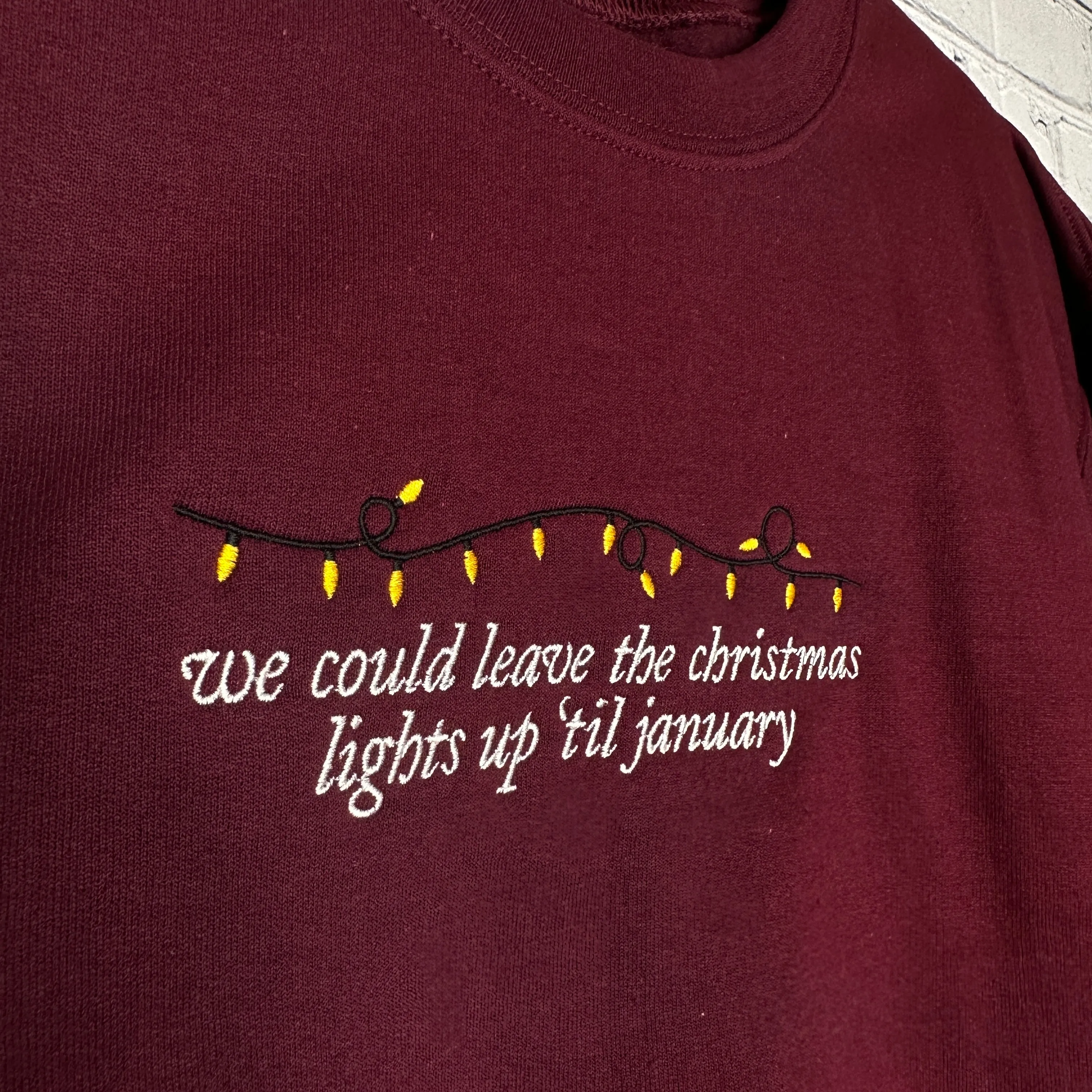 Lights Up 'Til January on Maroon Gildan Heavy Blend Sweatshirt