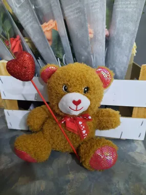 Teddy Bear with holding heart in hand symbol of love